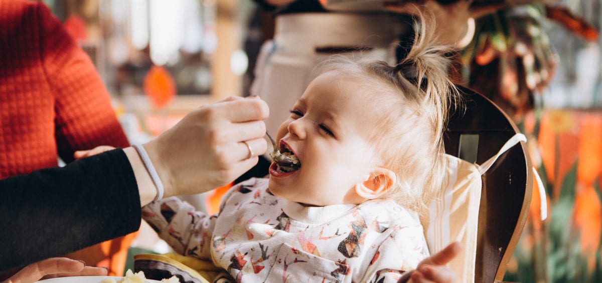 Happy baby in restaurant